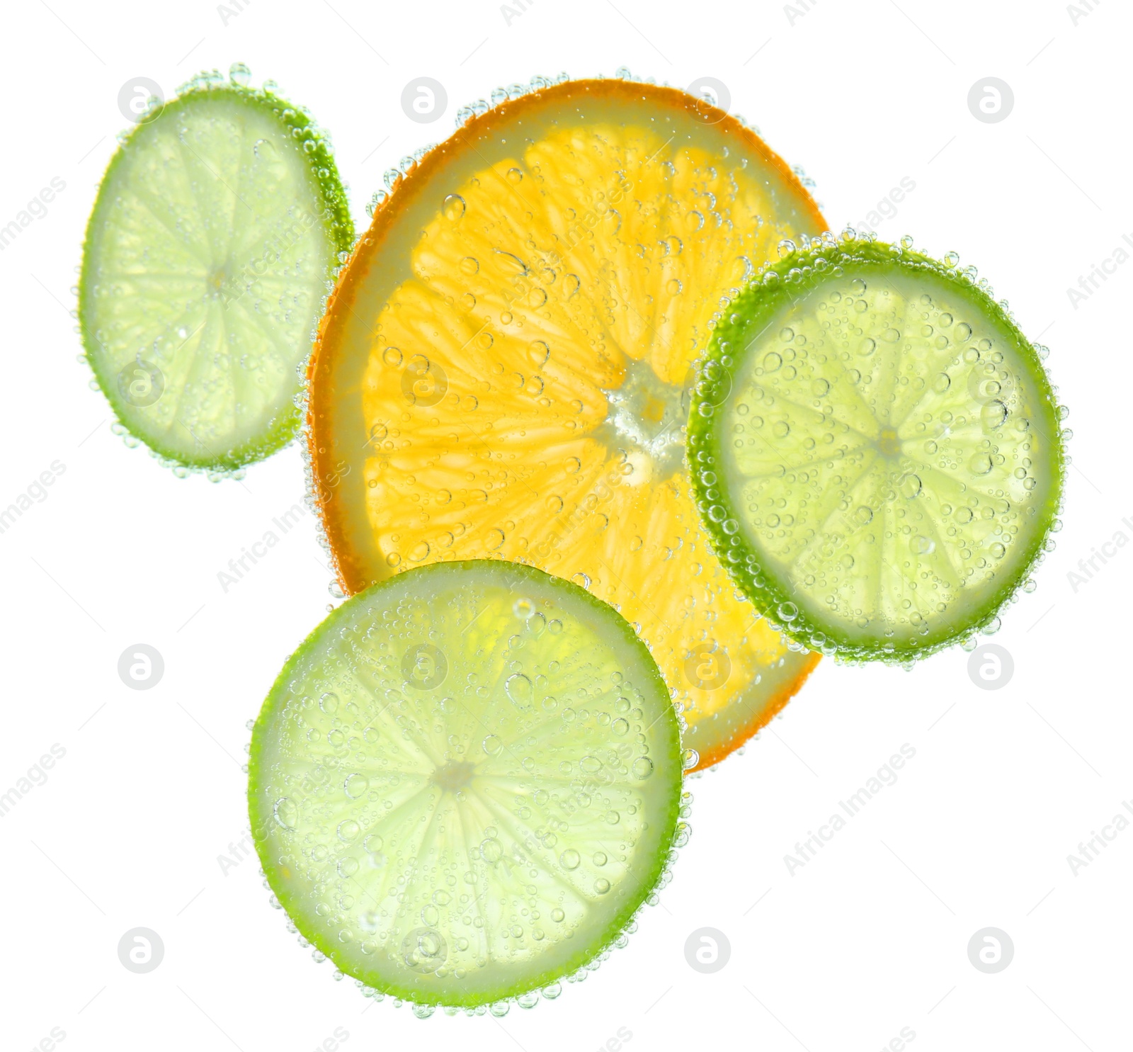 Photo of Slices of citrus fruits in sparkling water on white background