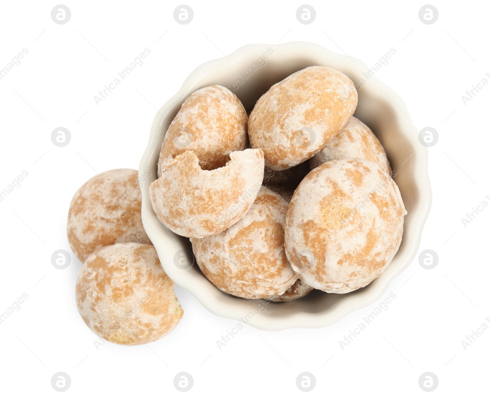 Photo of Tasty homemade gingerbread cookies in bowl on white background, top view