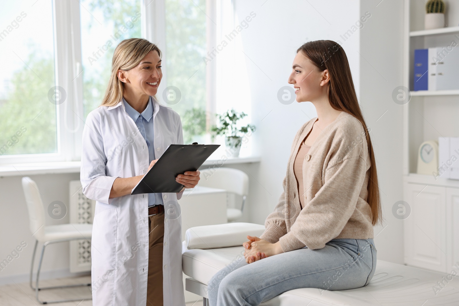 Photo of Professional doctor working with patient in hospital