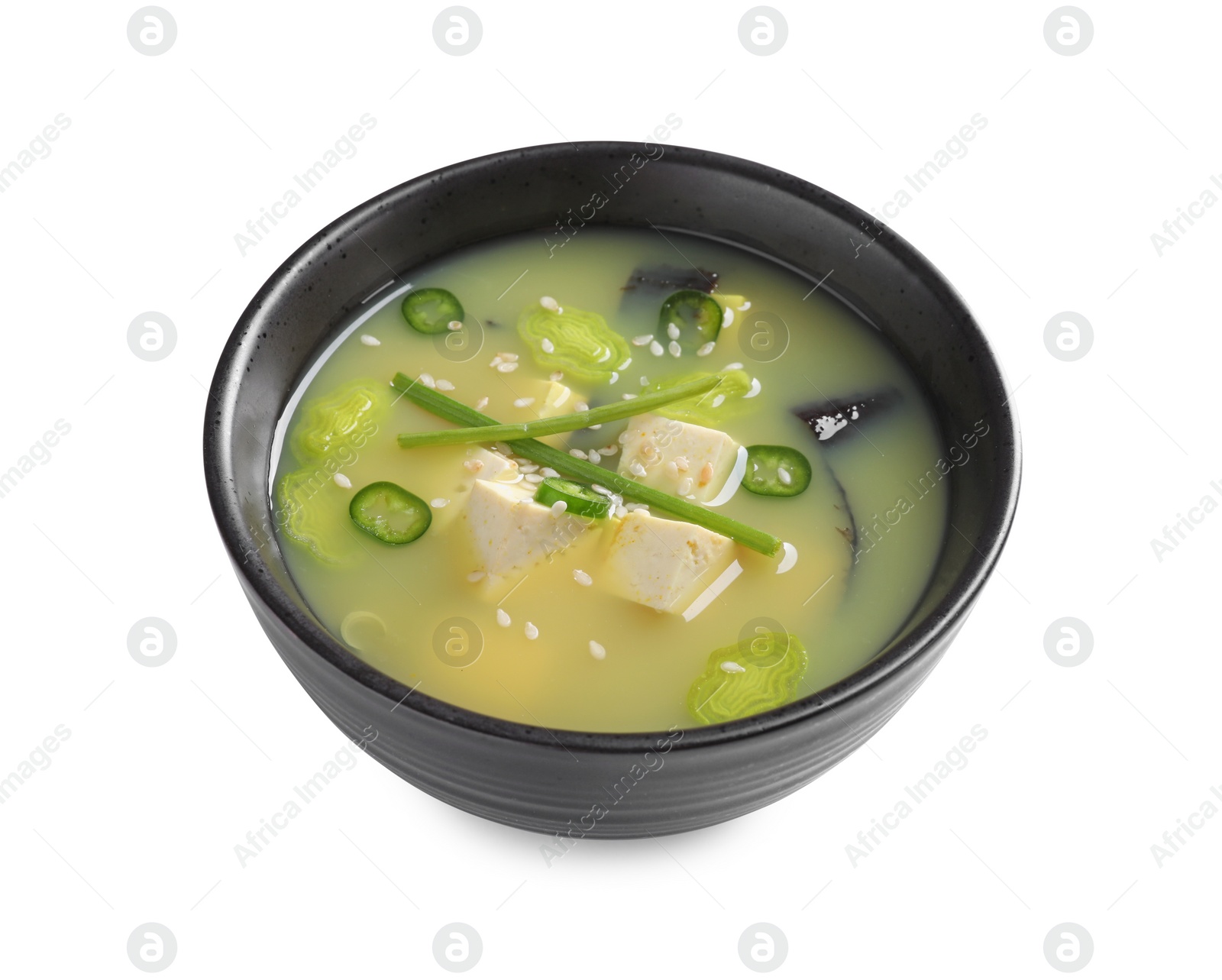 Photo of Bowl of delicious miso soup with tofu isolated on white