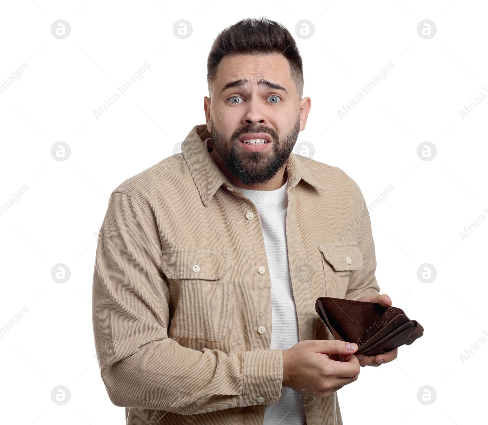 Photo of Confused man showing empty wallet on white background