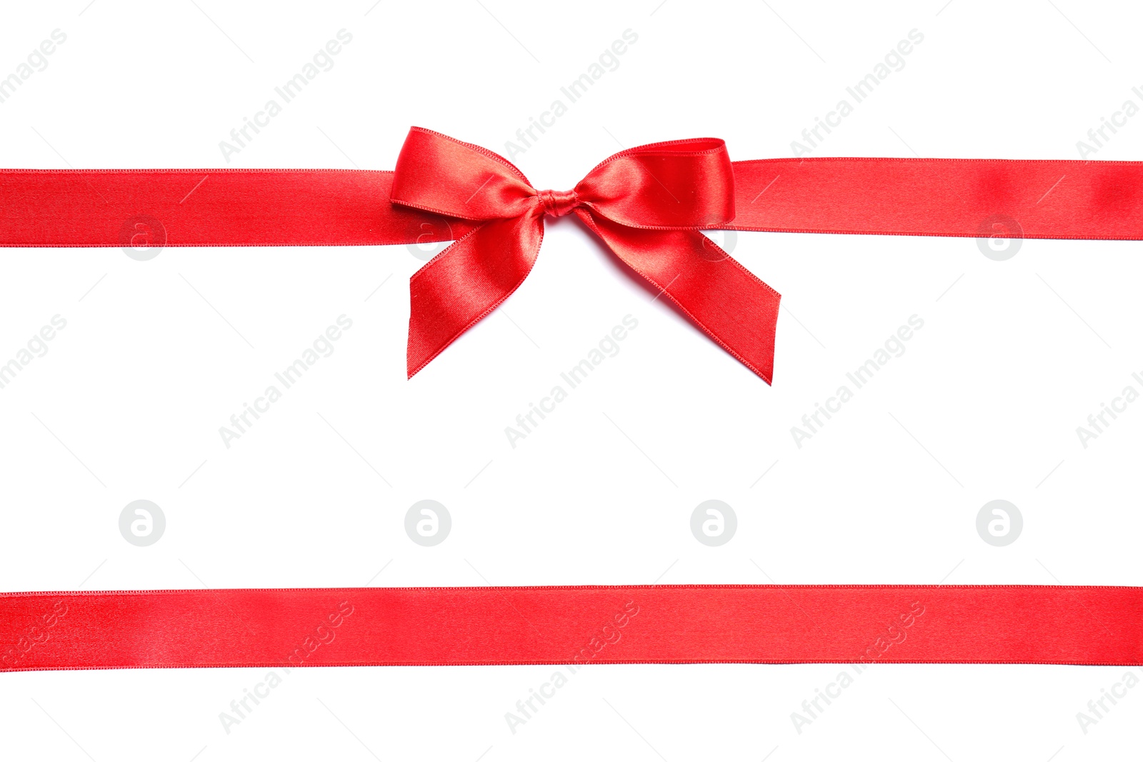 Photo of Red ribbons with bow on white background, top view