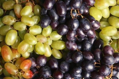 Photo of Fresh ripe juicy grapes as background, closeup