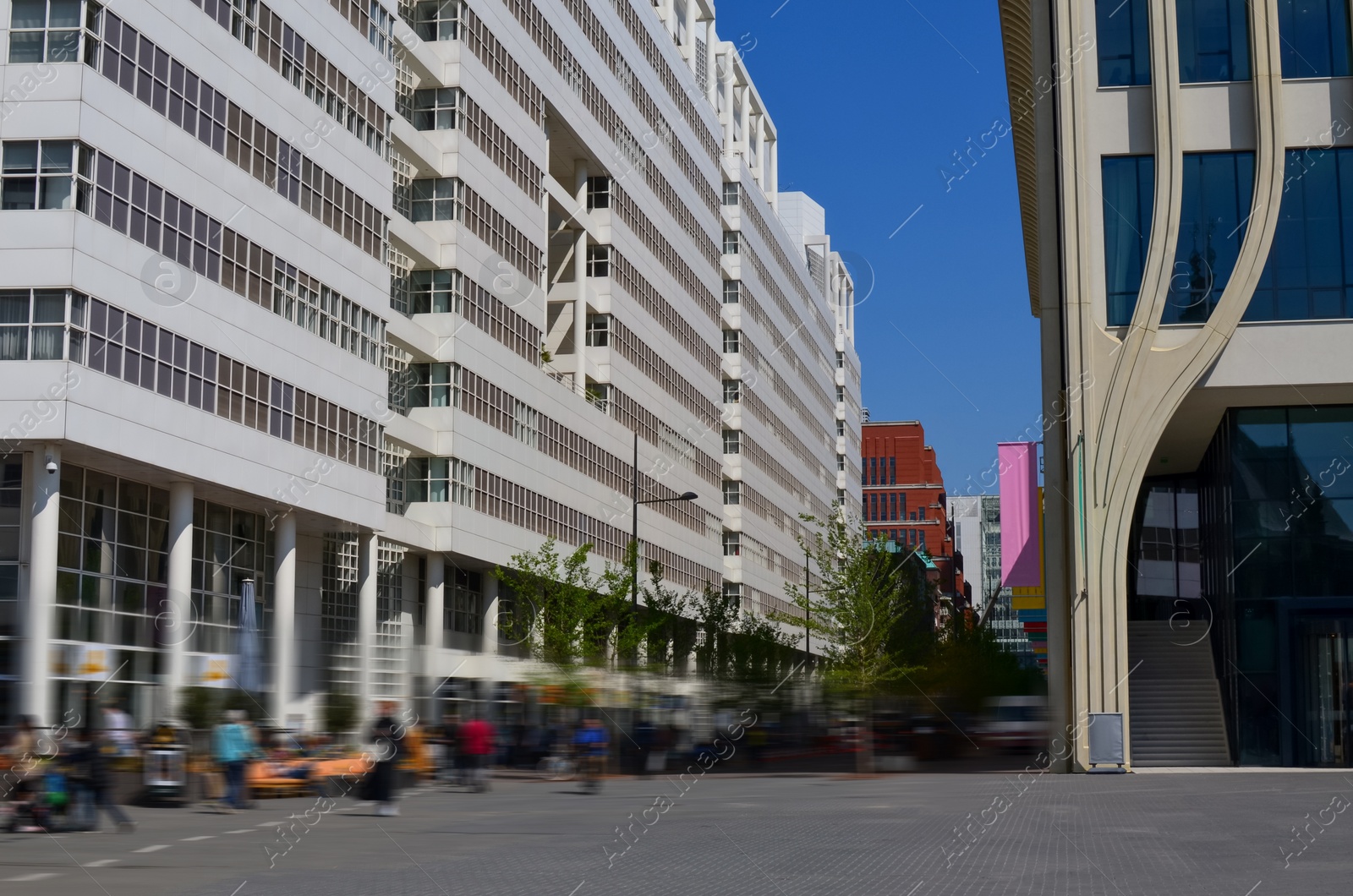 Photo of Beautiful modern buildings in city street. Urban architecture