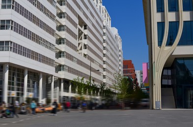 Photo of Beautiful modern buildings in city street. Urban architecture
