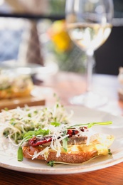 Delicious bruschettas served on wooden table in cafe