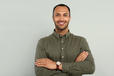 Photo of Portrait of handsome young man on gray background