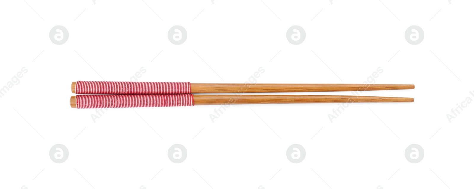 Photo of Pair of wooden chopsticks isolated on white, top view