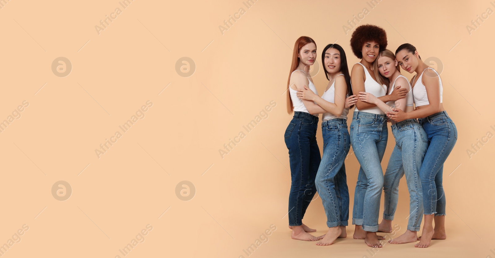 Image of Portrait of beautiful young women on beige background. Banner design with space for text