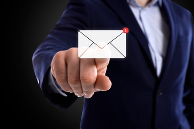 Image of Email. Man touching virtual screen with incoming letter notification against black background, closeup