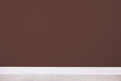 Photo of Blank brown wall in room. Space for design