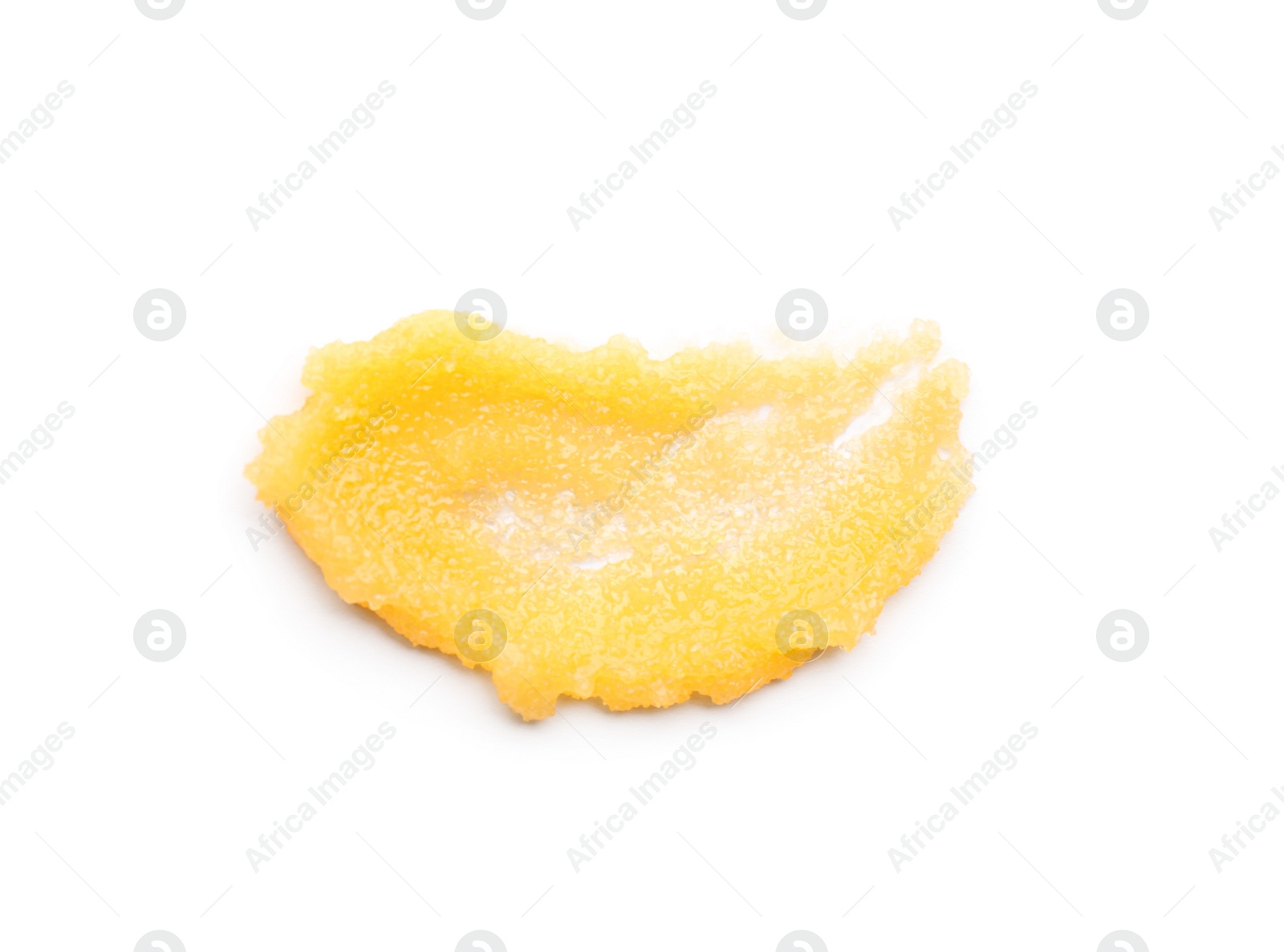 Photo of Smear of orange body scrub isolated on white, top view