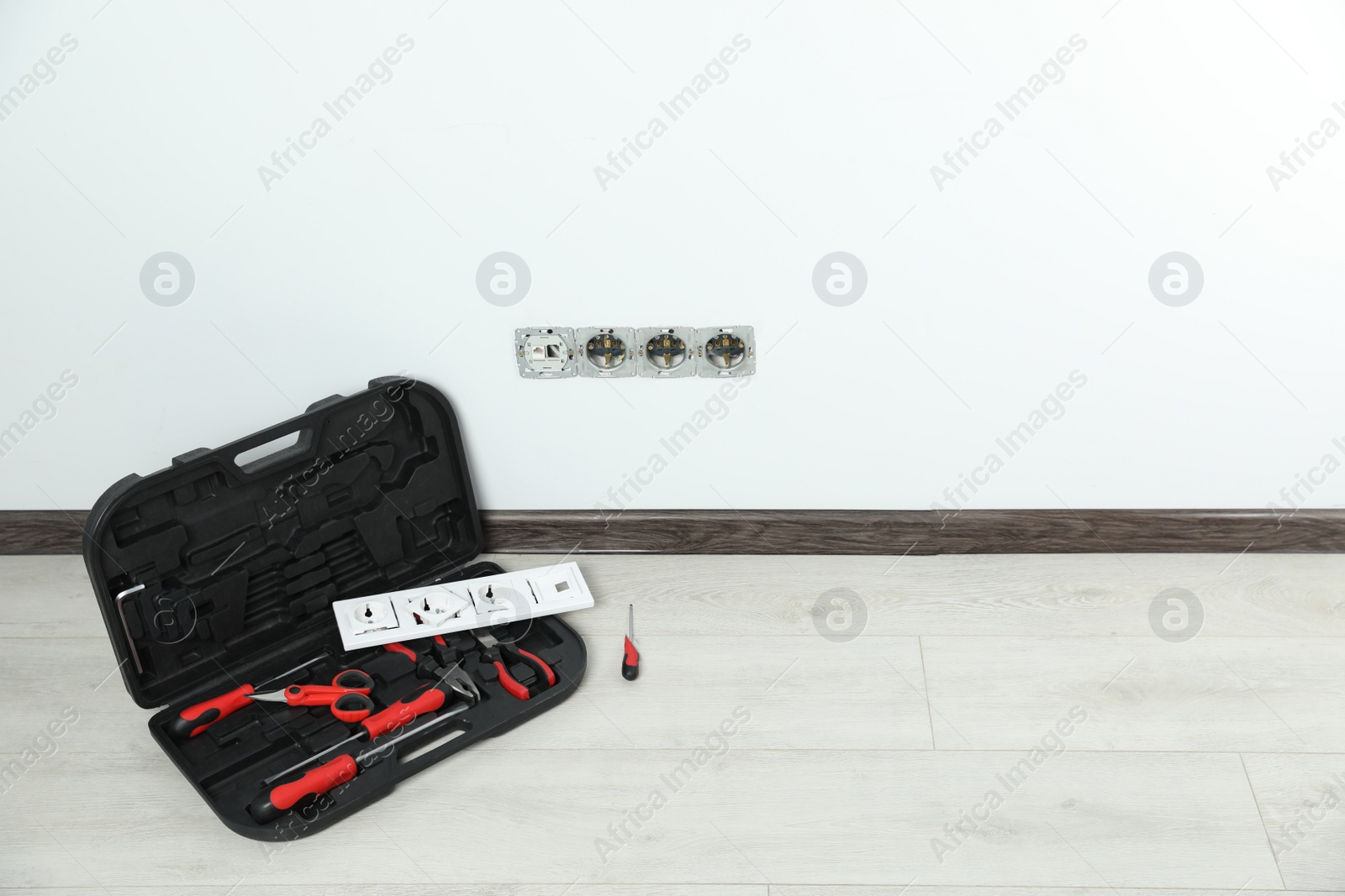 Photo of Set of tools and sockets in room. Space for text
