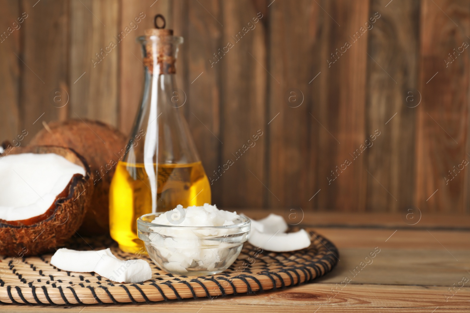 Photo of Composition with coconut oil on table. Healthy cooking