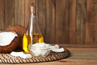 Composition with coconut oil on table. Healthy cooking