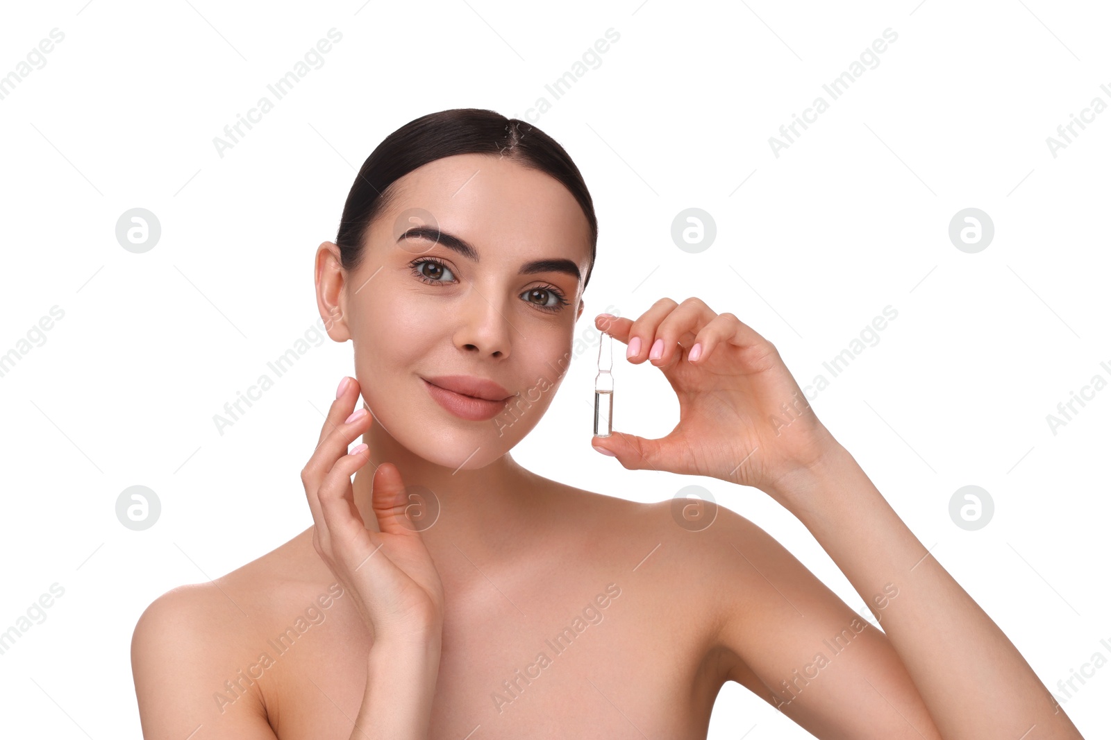 Photo of Beautiful young woman holding skincare ampoule on white background