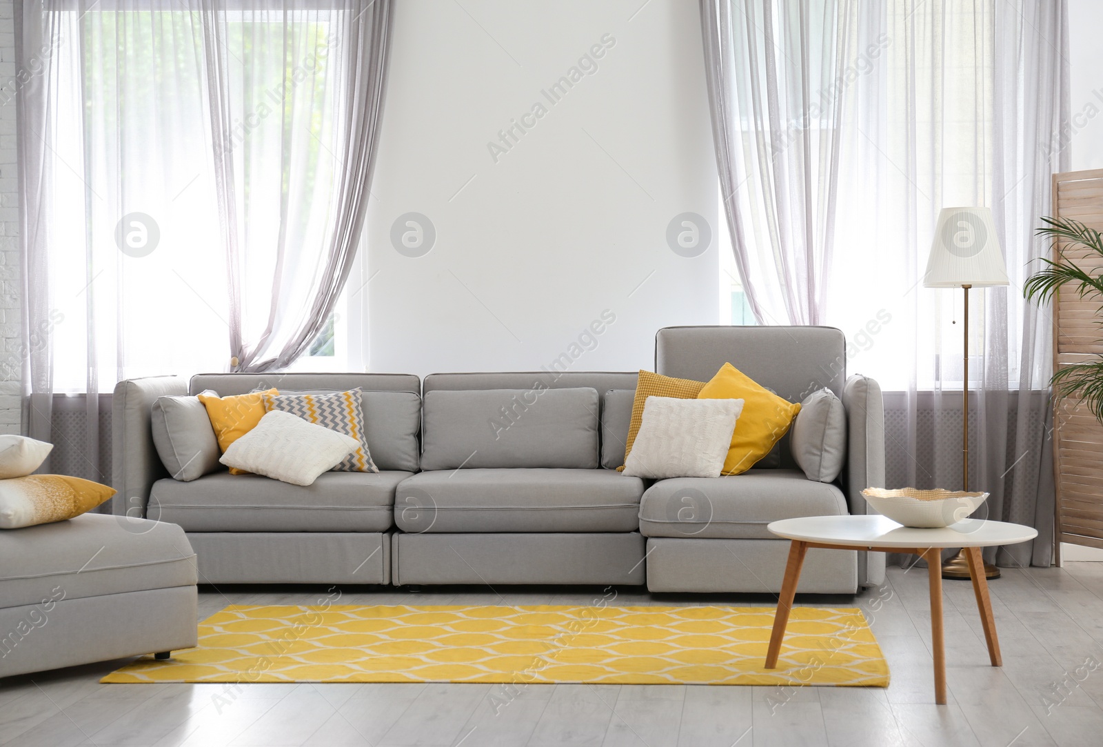 Photo of Living room with comfortable sofa and stylish decor. Idea for interior design