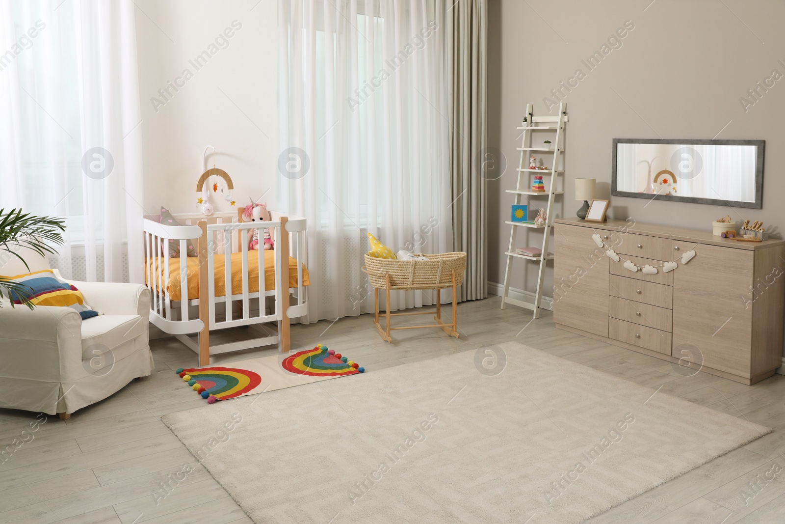 Photo of Beautiful baby room interior with stylish furniture