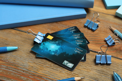 Photo of Credit cards and stationery on wooden table