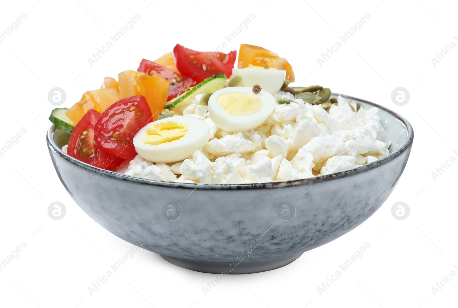 Photo of Fresh cottage cheese with vegetables and eggs in bowl isolated on white