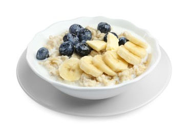 Tasty oatmeal with banana, blueberries, milk and butter in bowl isolated on white