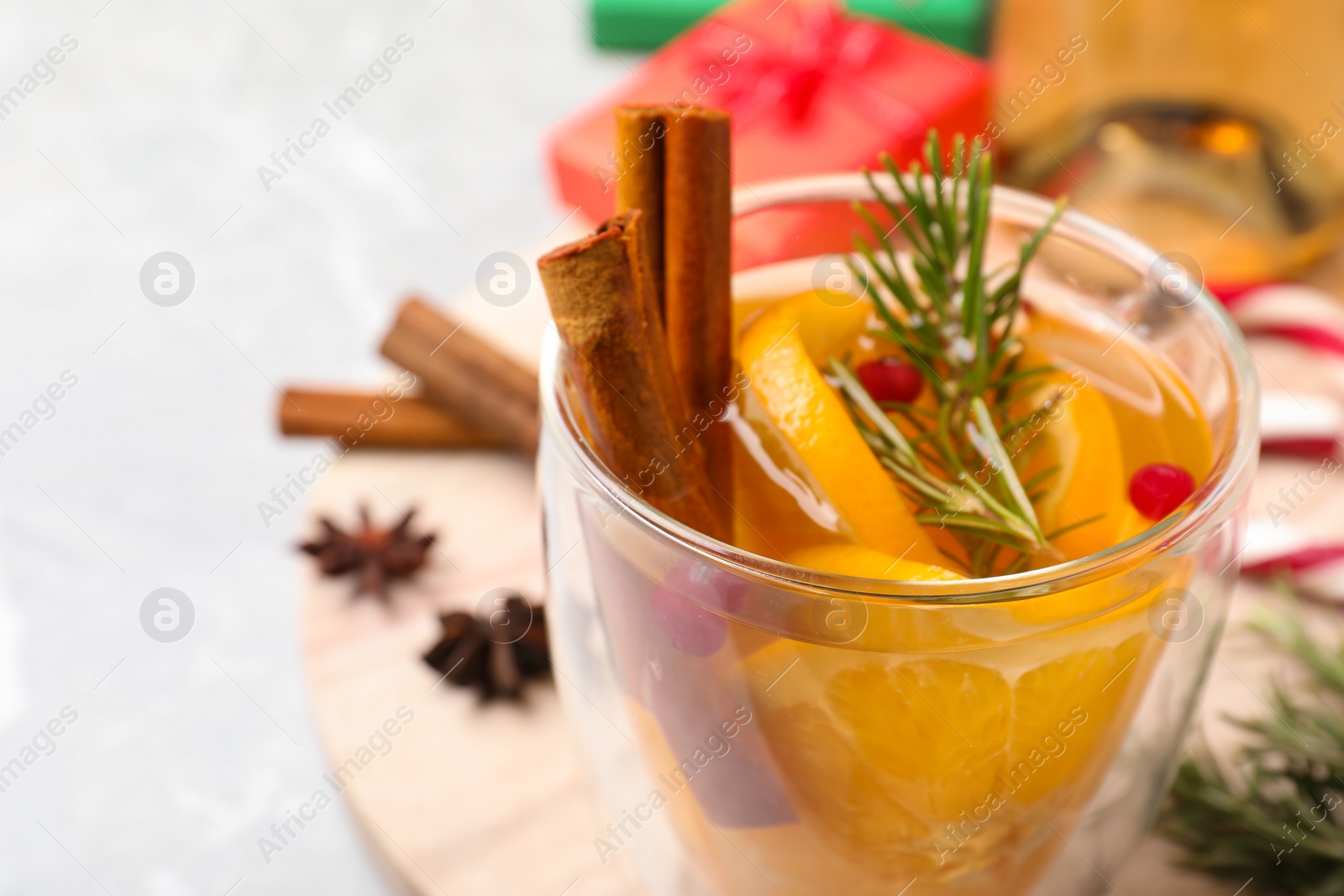 Photo of Delicious aromatic mulled wine on table, closeup