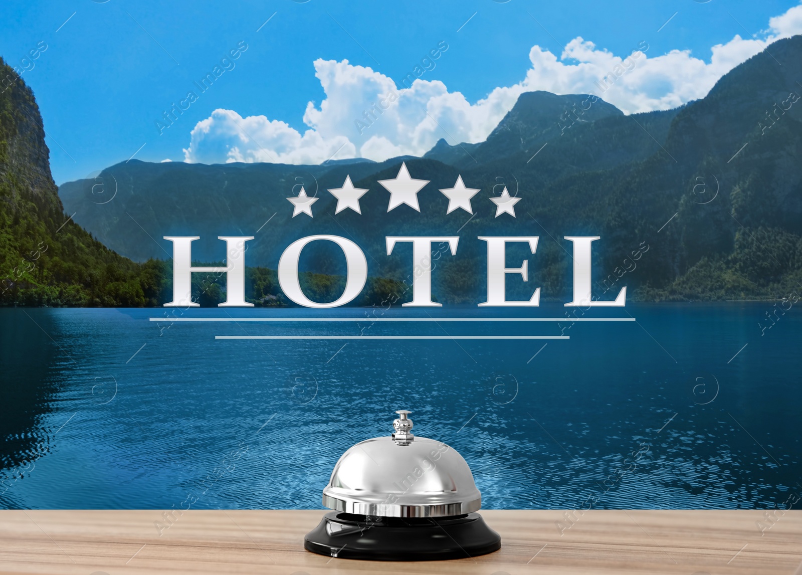 Image of 5 Star hotel. Reception desk with service bell and picturesque landscape on background