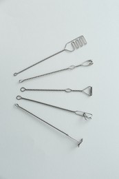 Set of logopedic probes for speech therapy on light grey background, flat lay