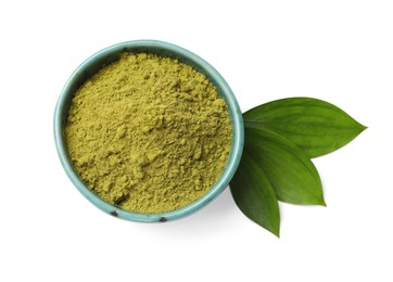 Photo of Henna powder in bowl and green leaves isolated on white, top view