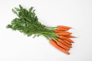 Photo of Ripe carrots on white background. Healthy diet