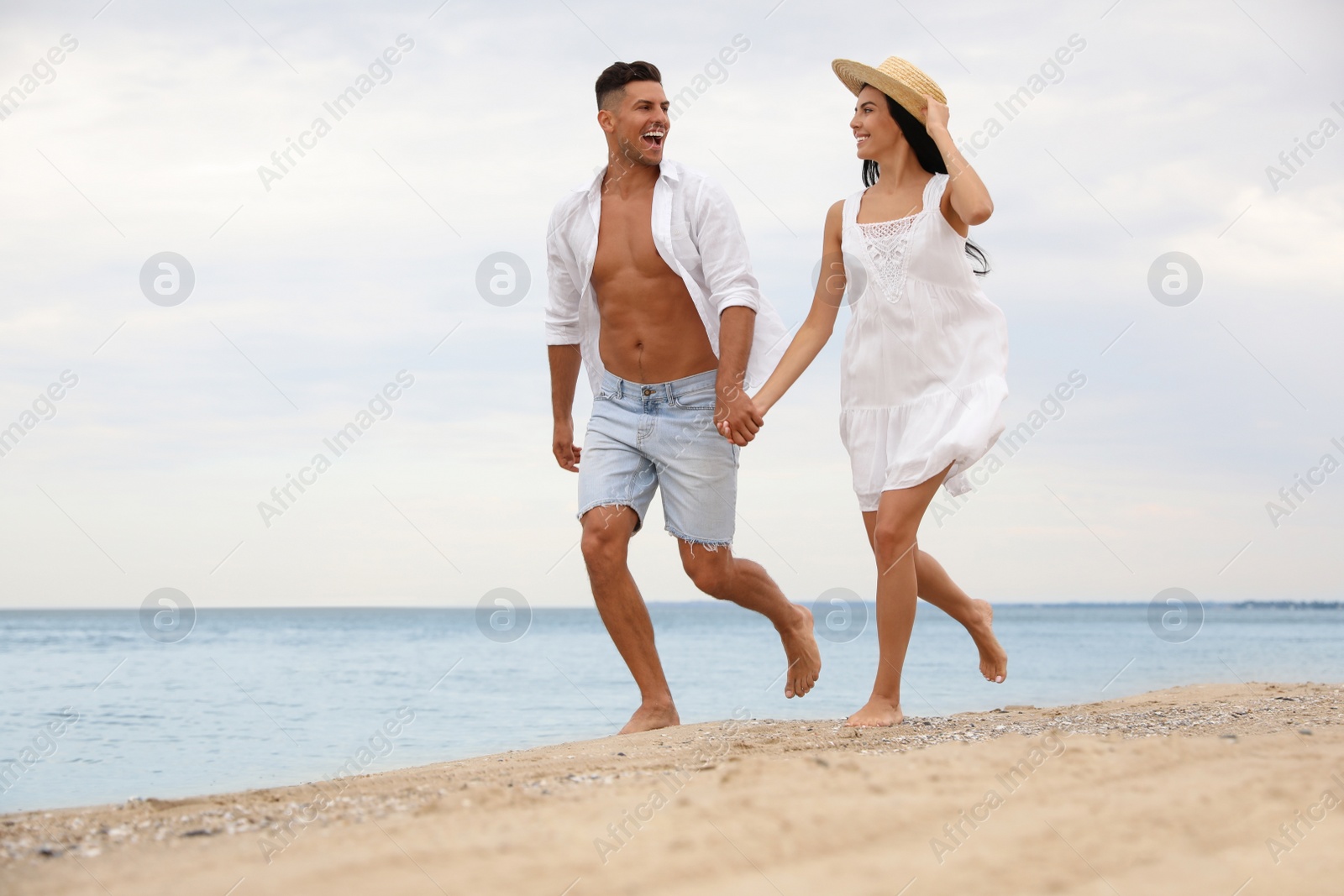 Photo of Lovely couple having fun on beautiful beach