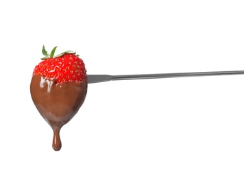 Tasty strawberry dipped into chocolate fondue on white background