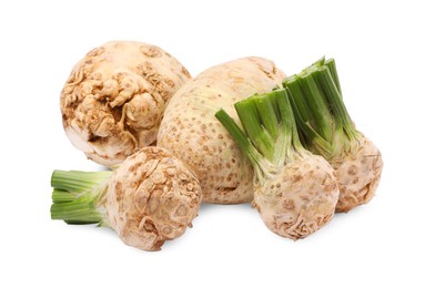 Photo of Many raw celery roots isolated on white