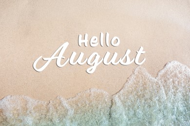 Image of Hello August. Sea waves and beautiful sandy beach, top view