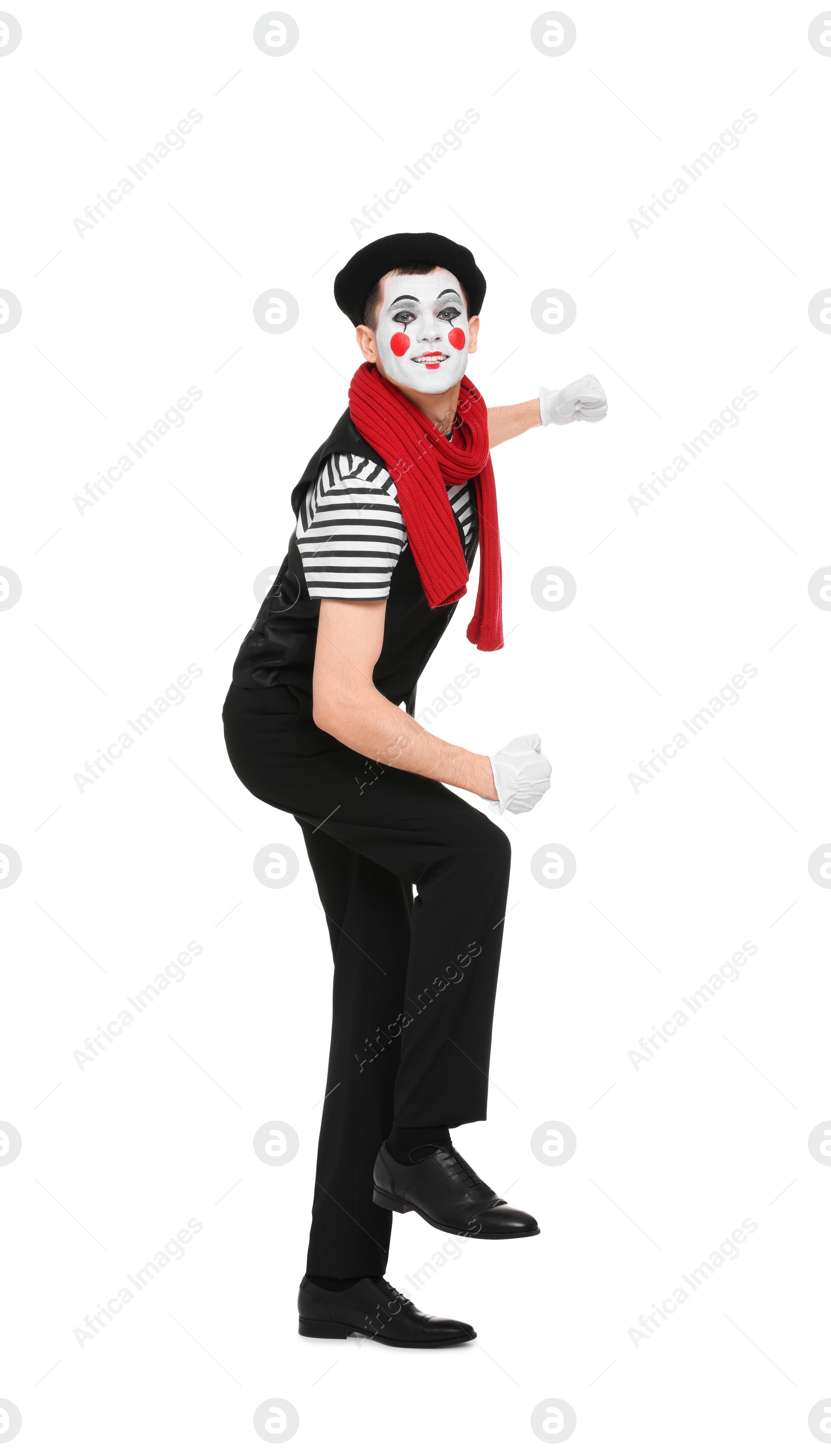 Photo of Funny mime artist in beret posing on white background