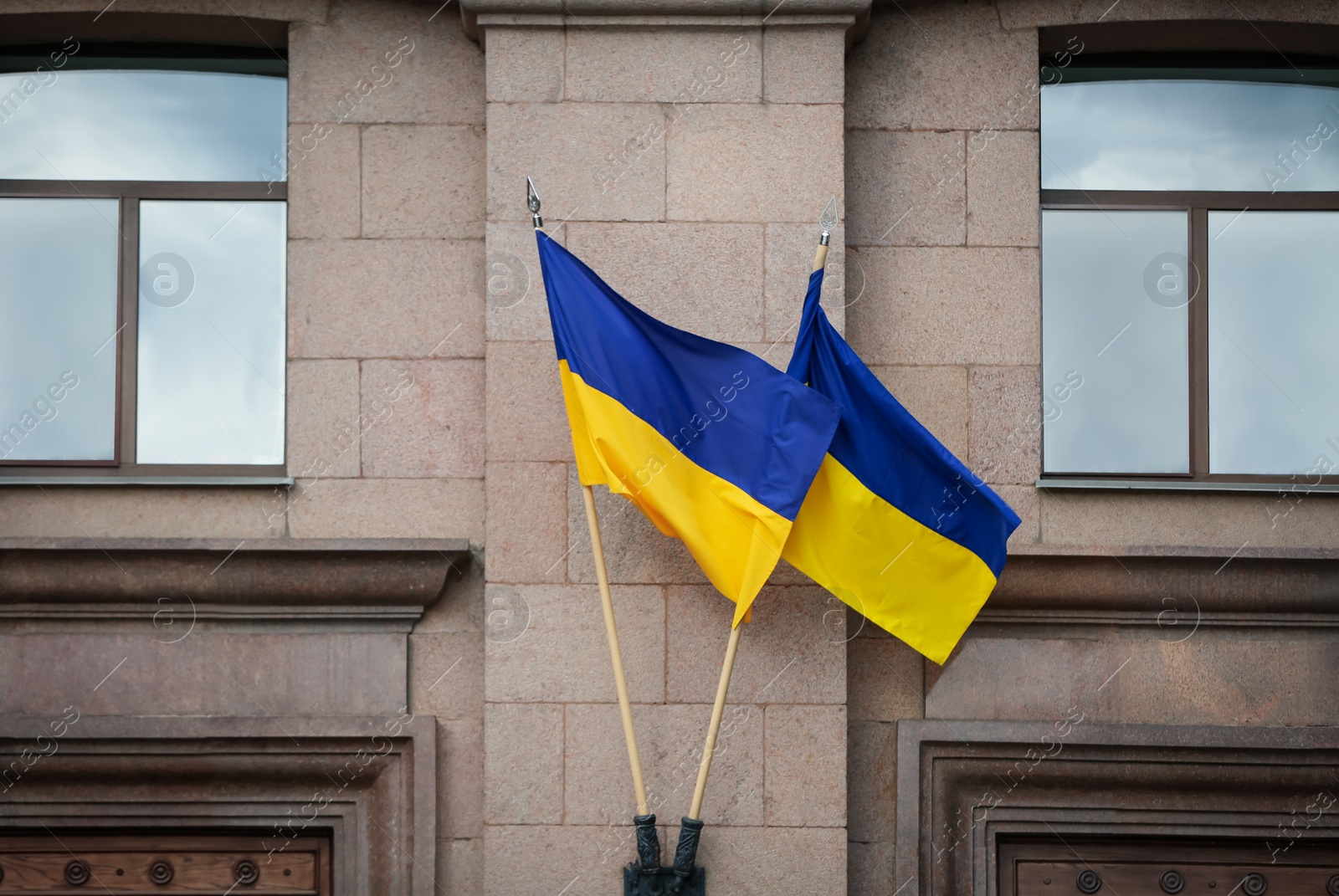 Photo of National flags of Ukraine on building facade