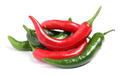 Ripe hot chili peppers on white background