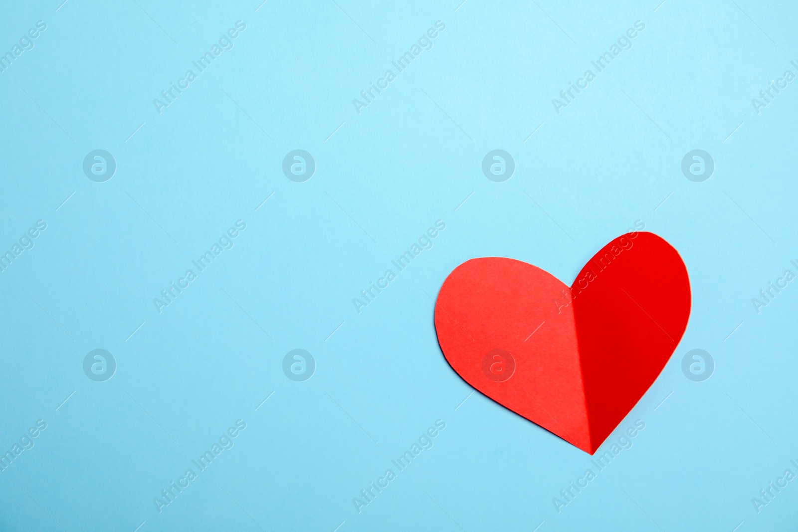 Photo of Small paper heart on color background