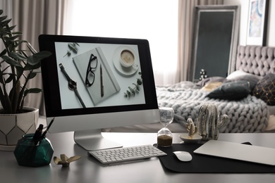 Photo of Stylish workplace interior with modern computer on desk