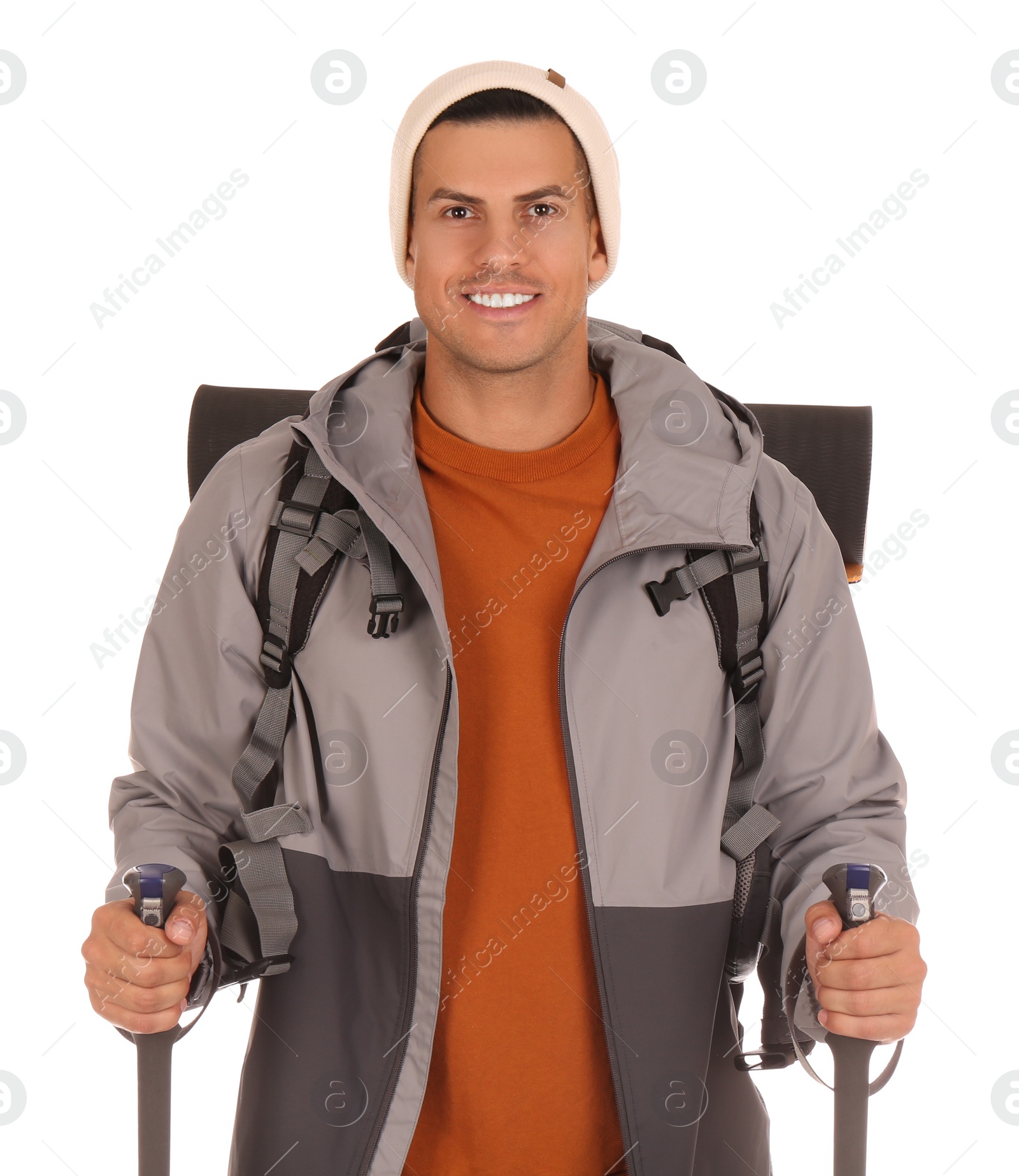 Photo of Male hiker with backpack and trekking poles on white background