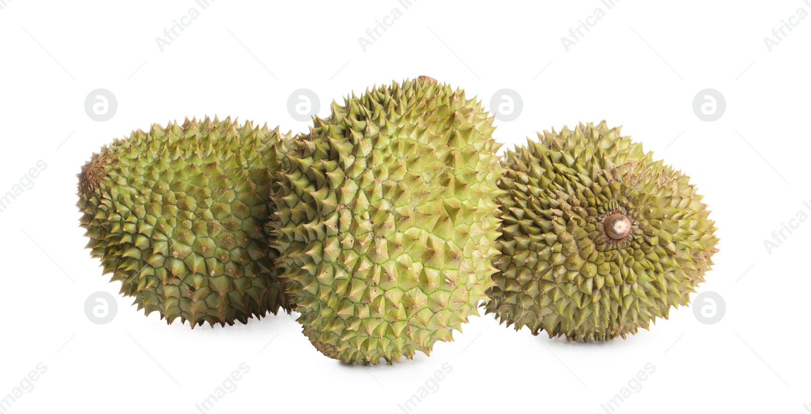 Photo of Whole ripe durian fruits on white background