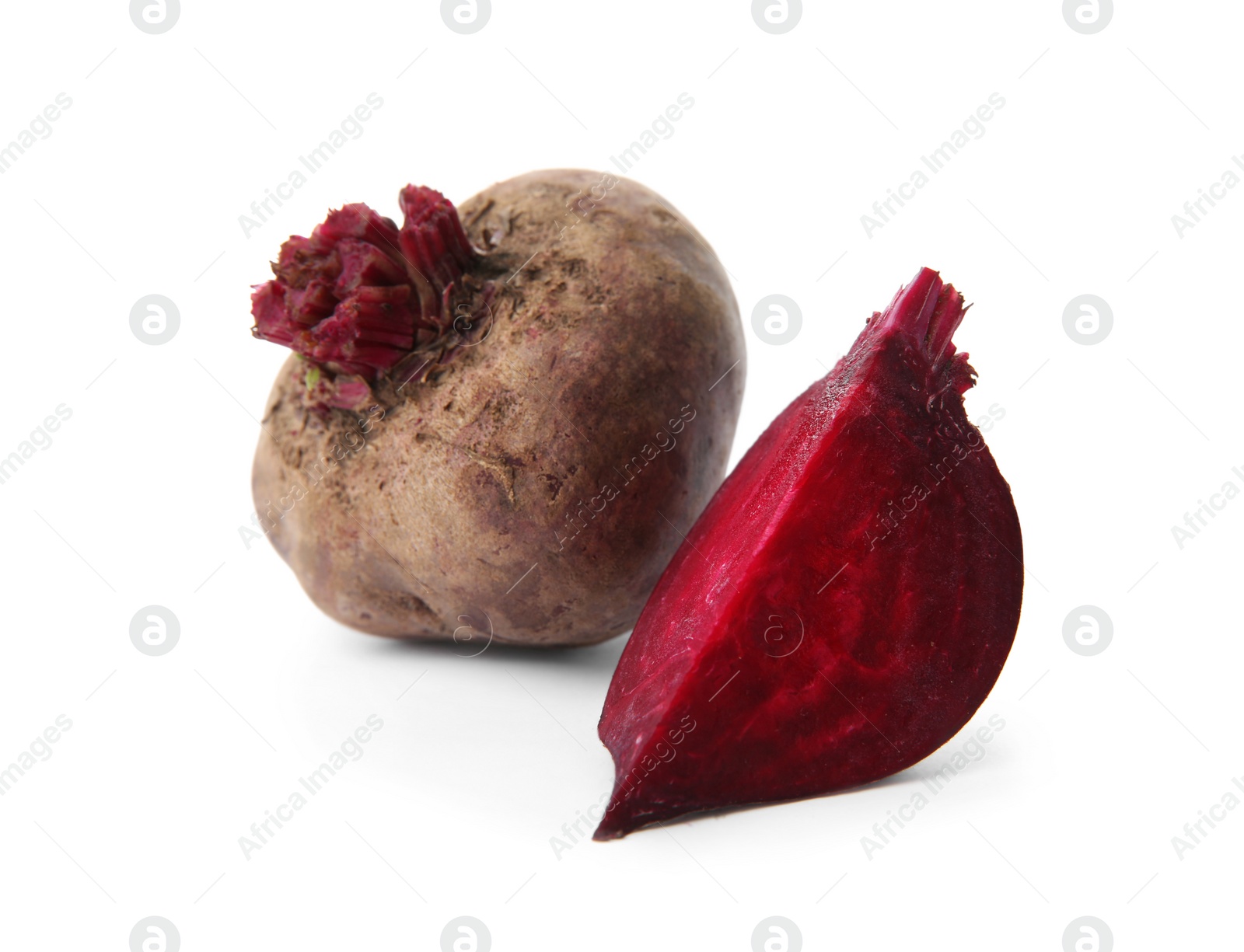 Photo of Whole and cut fresh red beets on white background