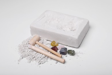 Photo of Excavation kit on white background. Educational toy for motor skills