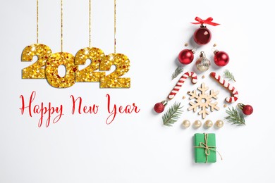 Image of Happy New 2022 Year! Christmas tree silhouette of fir branches and festive decoration on white background, top view