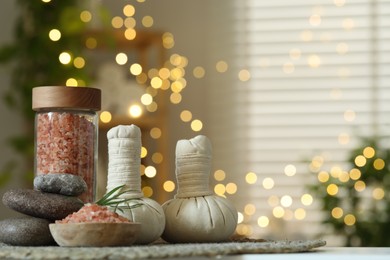 Photo of Composition with different spa products on table indoors, space for text