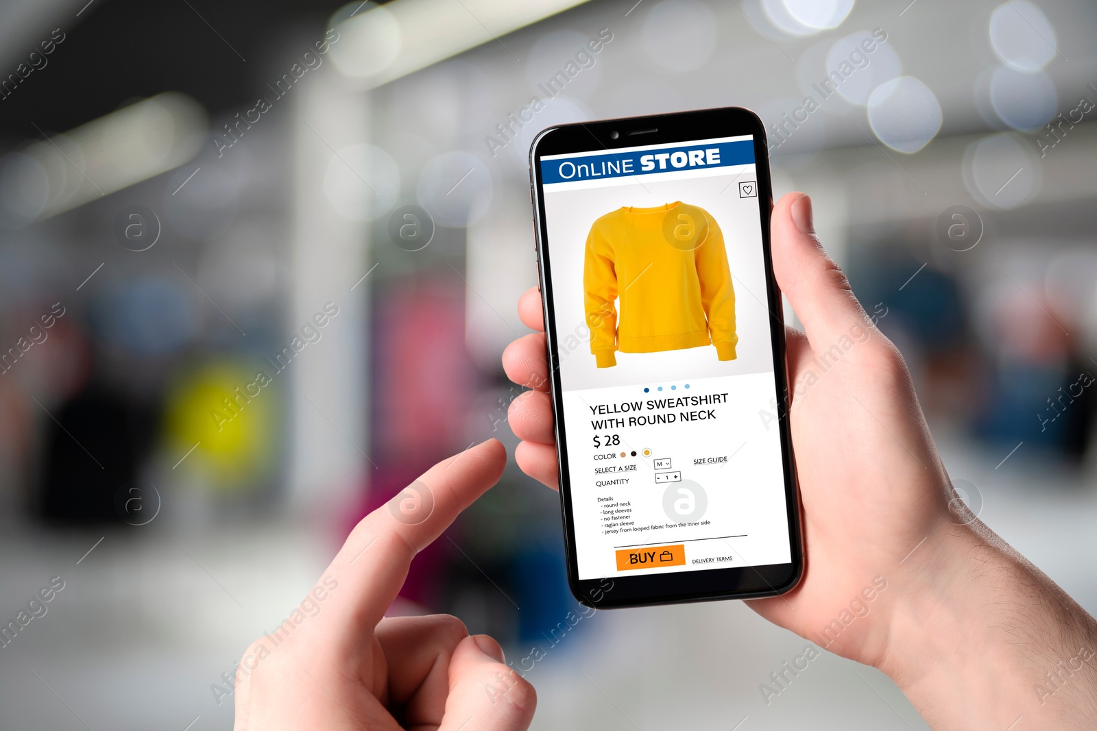 Image of Man visiting shop to take ordered sweatshirt indoors, closeup. Online store website on device screen
