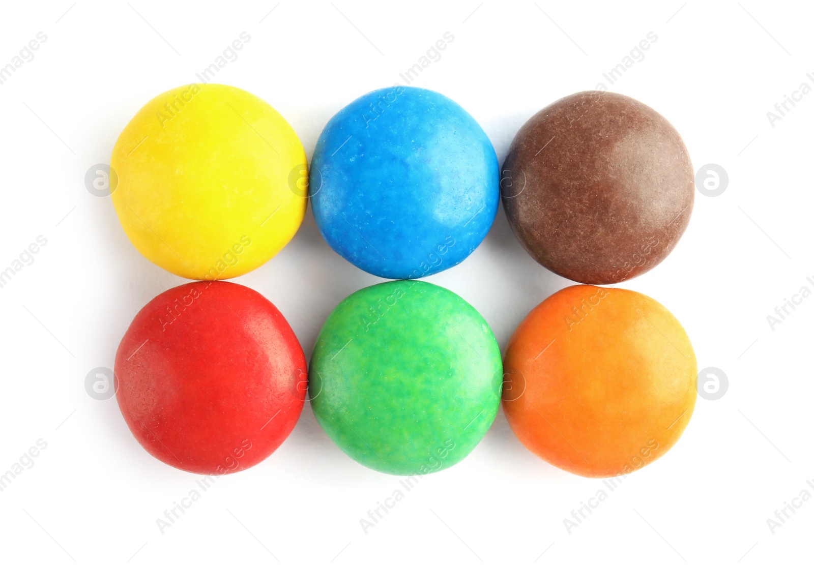 Photo of Tasty colorful candies on white background, top view