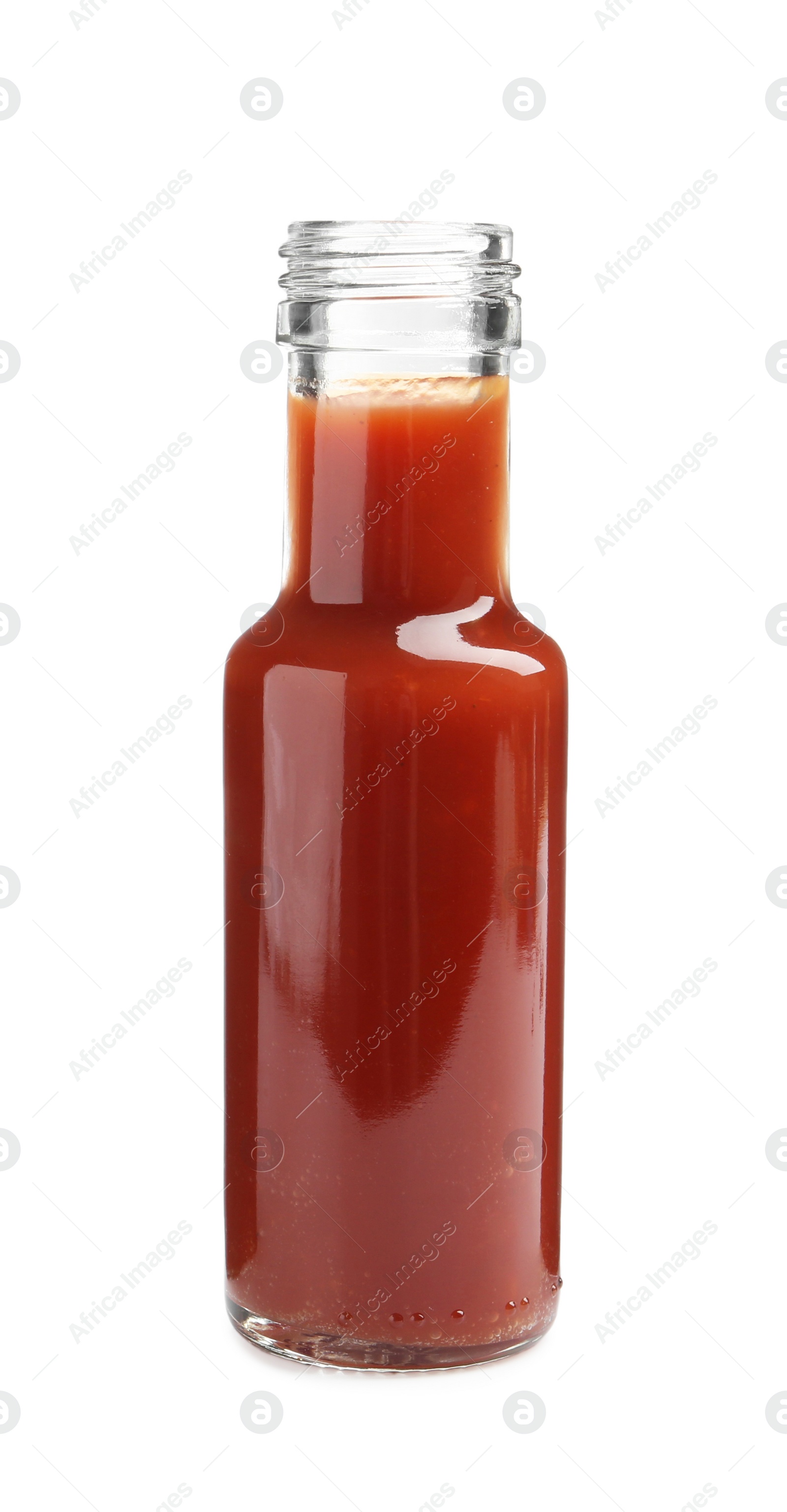 Photo of Tasty ketchup in glass bottle isolated on white. Tomato sauce