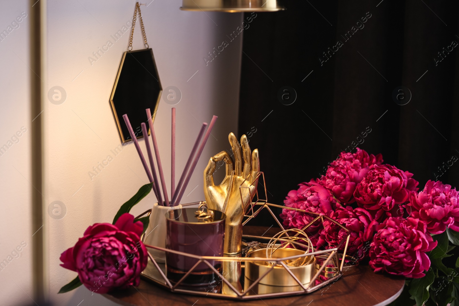 Photo of Composition with stylish accessories, flowers and interior elements on table indoors