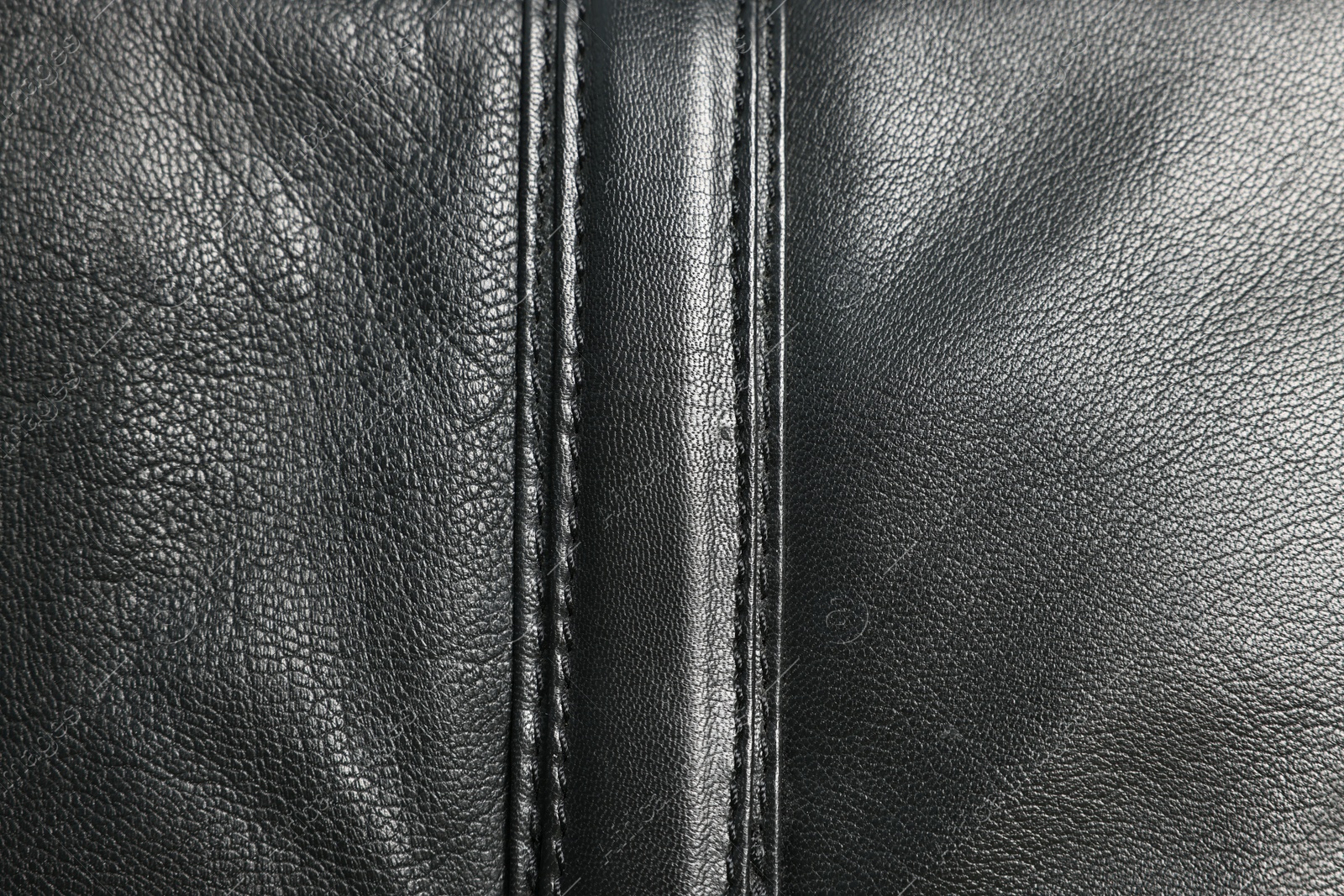 Photo of Black natural leather with seams as background, top view